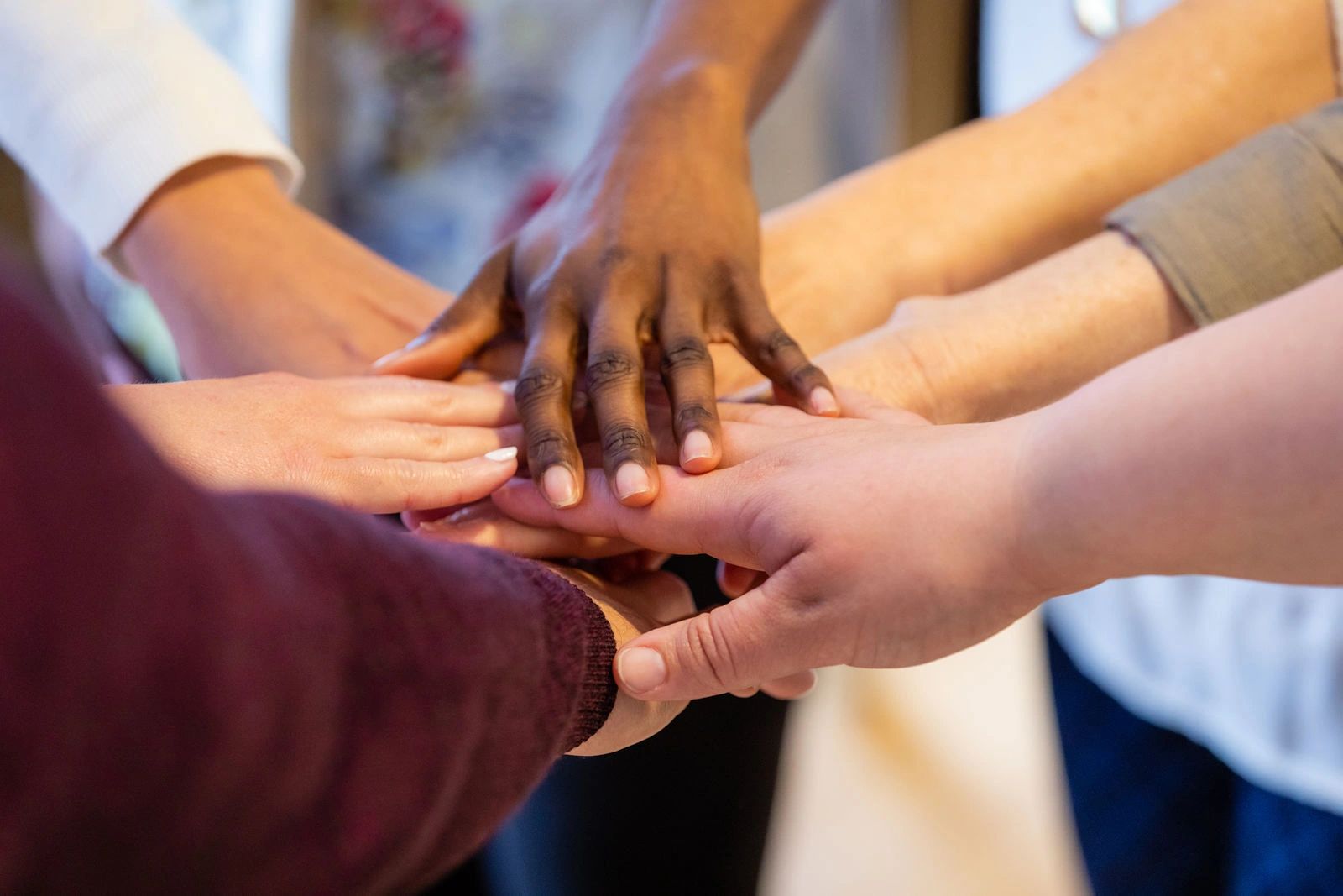 Diverse hands together